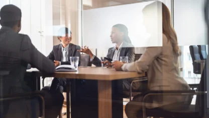 Image of people at a desk