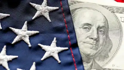 Image of American flag draped over a one hundred dollar bill, symbolizing patriotism and wealth