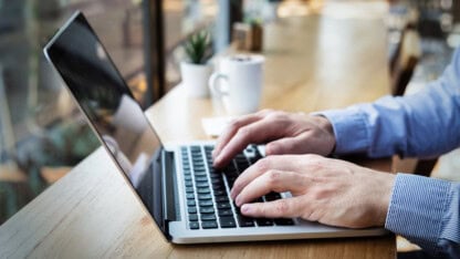 Remote worker typing on a keyboard connected to VPN