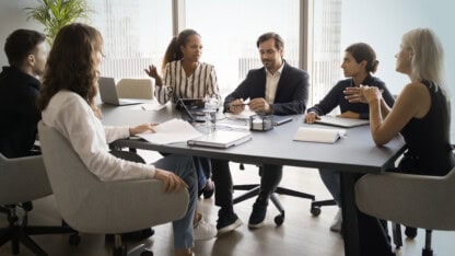 Team meeting in a conference room to discuss international tax concerns