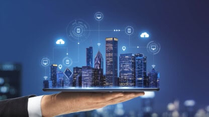 Image of city emerging from a tablet screen representing AI adoption and risks for state and local governments