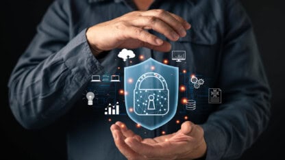 Hands presenting a series of symbols representing cybersecurity