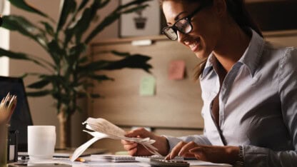 Professional business woman calculating multistate taxes