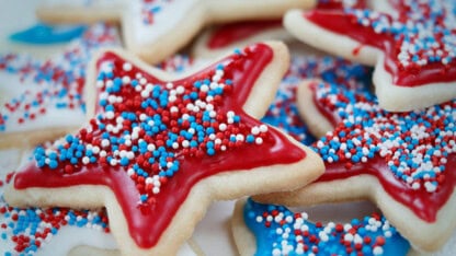 Star sugar cookies decorated with icing and sprinkles