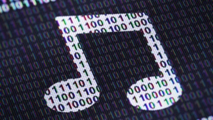 A musical note rendered digitally in front of binary code